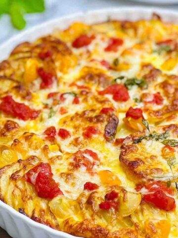 Baked Potato Frittata in a round ceramic dish with a golden, crispy top.