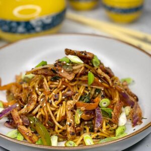 Savory pork and cabbage with noodles, all cooked conveniently in a single pot.